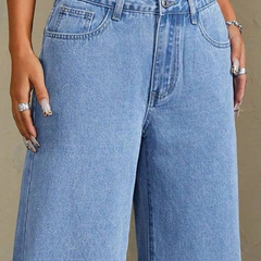 Women's blue mid-rise stretchable wide leg jeans with slash knee detailing.