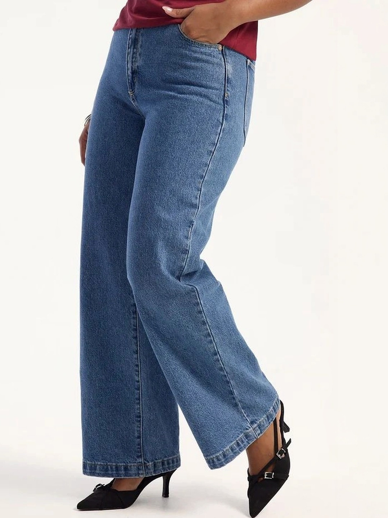 Women's light blue super wide leg high-rise stretchable jeans.
