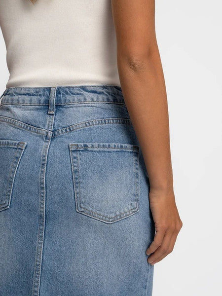 Light blue denim midi skirt with front slit and high-rise fit for women