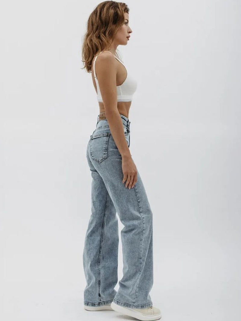 Women's light blue wide leg high-rise stretchable jeans with light fade detailing.