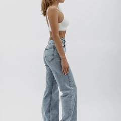 Women's light blue wide leg high-rise stretchable jeans with light fade detailing.