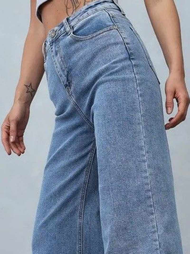 Women's light blue loose high-rise stretchable jeans with acid wash detailing.