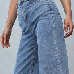 Women's light blue loose high-rise stretchable jeans with acid wash detailing.