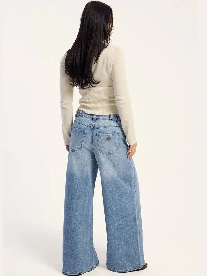 Women's light blue loose high-rise stretchable flared jeans.