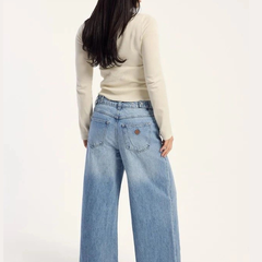 Women's light blue loose high-rise stretchable flared jeans.