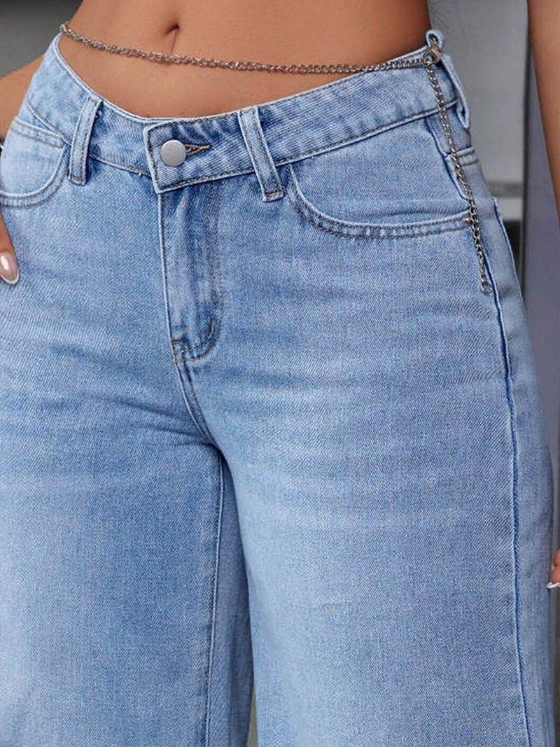 Women's light blue flared high-rise stretchable jeans with low distress and light fade detailing.